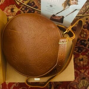 New in box Portland Leather round handbag.